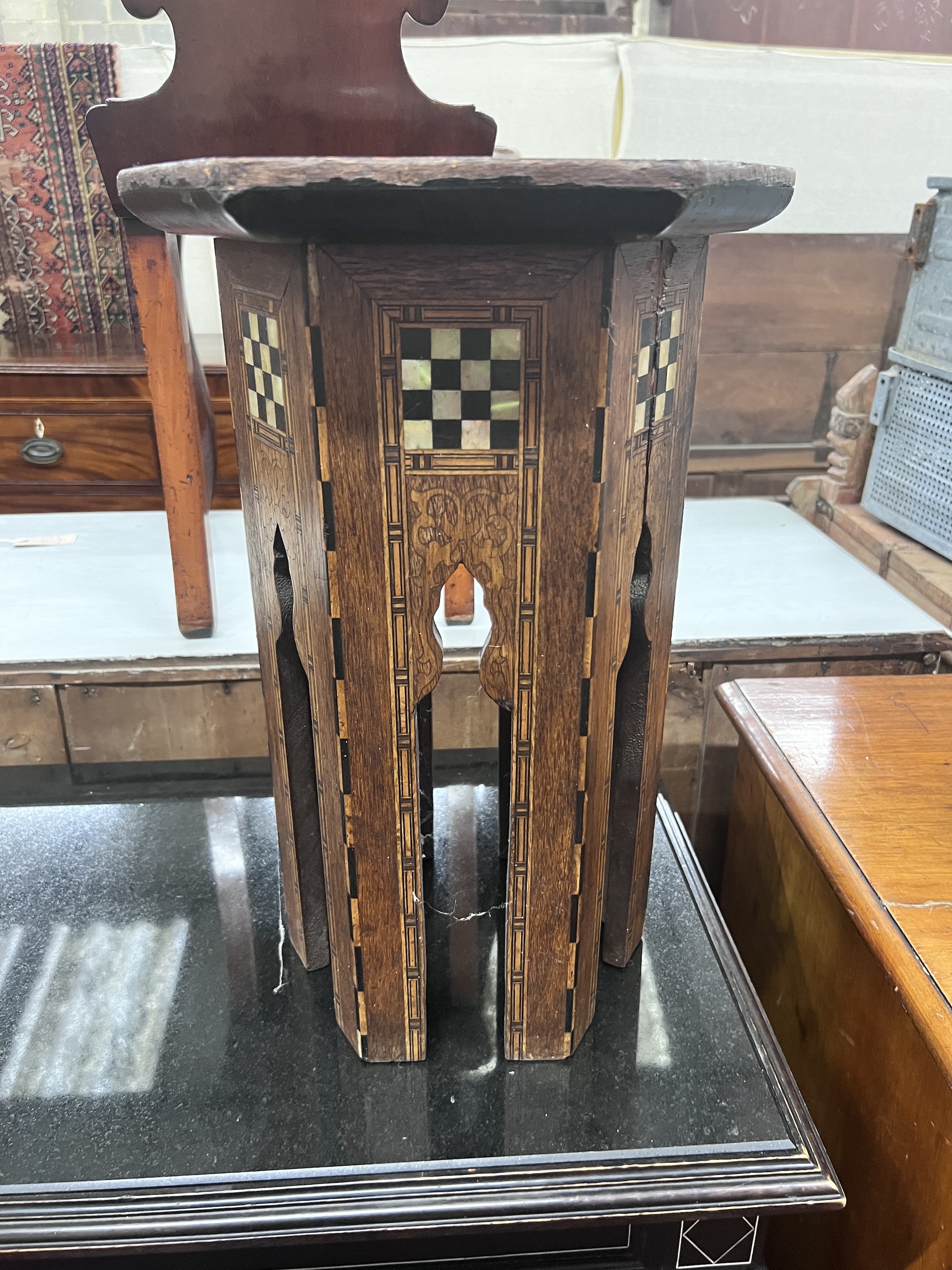 A Moorish mother of pearl inlaid hexagonal occasional table, width 32cm, height 46cm